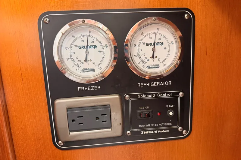 Slide: The Image of Freezer and refrigerator gauges on 2005 Tayana 48 yacht with solenoid control panel. - 81