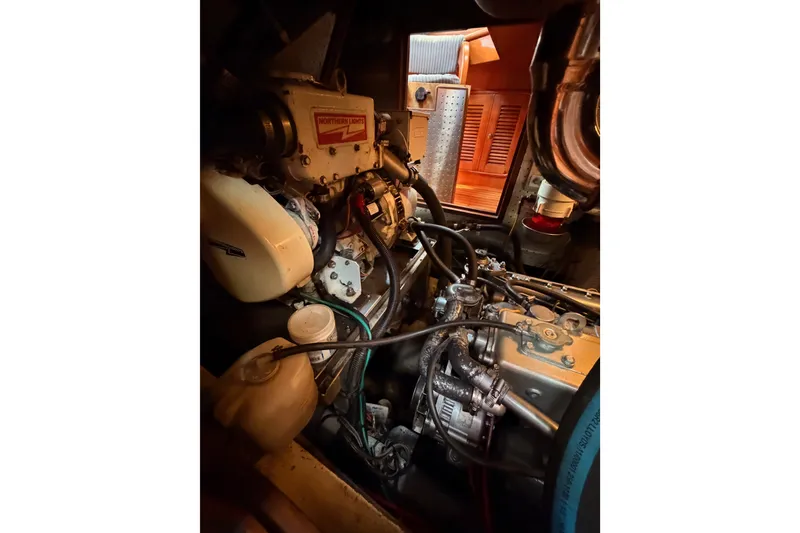 Slide: The Image of Engine room of a 2005 Tayana 48 yacht, featuring Northern Lights generator. - 104