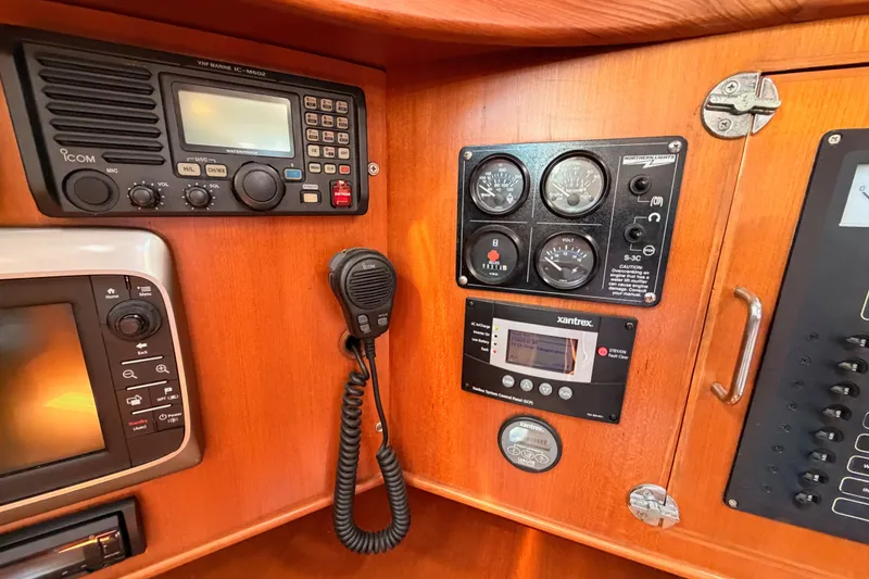Slide: The Image of Control panel of a 2005 Tayana 48 yacht with navigation and communication equipment. - 52