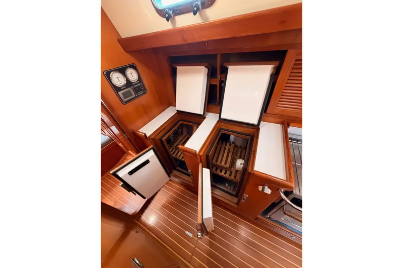Slide: The Image of Interior of 2005 Tayana 48 yacht showing wooden cabinetry and storage compartments. - 80