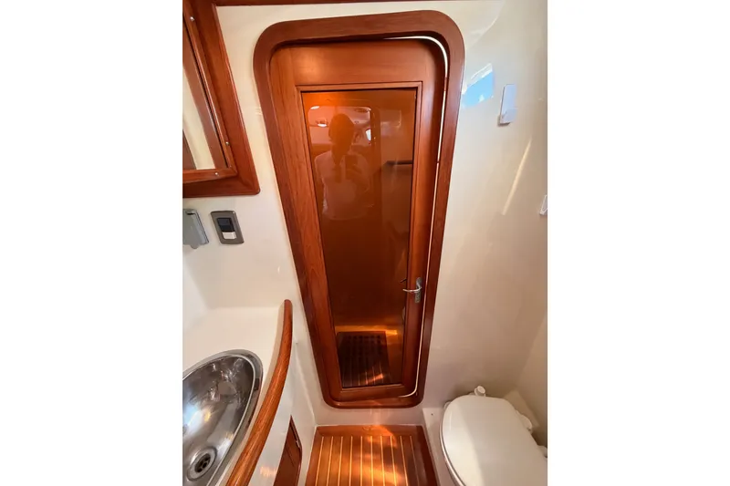 Slide: The Image of Interior of 2005 Tayana 48 yacht bathroom with wooden door and modern fixtures. - 91