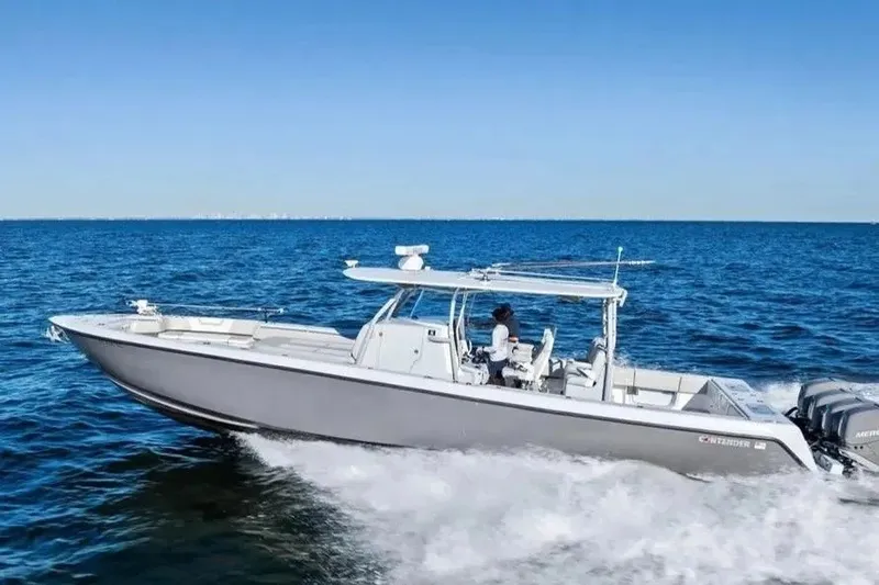 The Image of 2022 Contender 44 CB boat cruising on open blue ocean waters. - 1