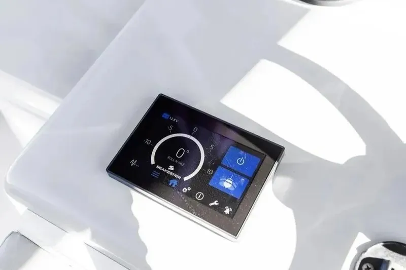Slide: The Image of Digital control panel on 2022 Contender 44 CB boat dashboard. - 18