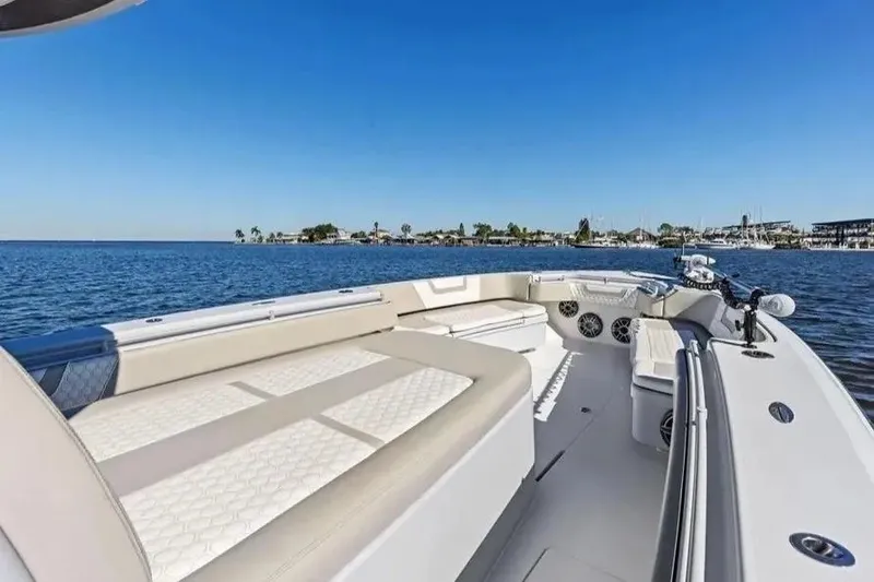Slide: The Image of 2022 Contender 44 CB boat with spacious seating on calm waters. - 22