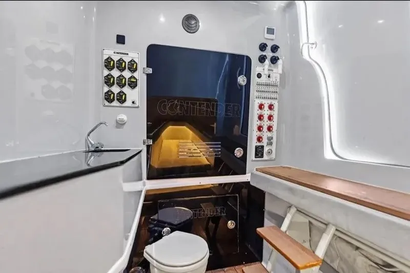 Slide: The Image of Interior of 2022 Contender 44 CB boat, featuring modern amenities and control panels. - 19