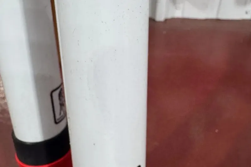 Slide: The Image of Close-up of a 2022 Contender 32 ST boat's white and red rod holder. - 10