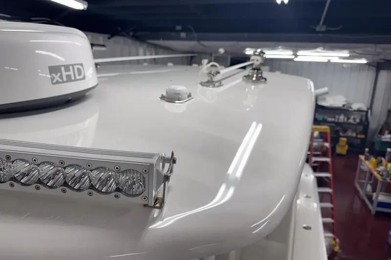 Slide: The Image of 2022 Contender 32 ST boat with xHD radar and LED light bar in a workshop. - 7