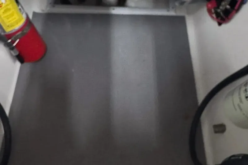 Slide: The Image of 2022 Contender 32 ST boat interior with fire extinguisher and equipment. - 9