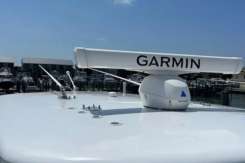 Slide: The Image of Garmin radar on 2021 Contender 35 ST boat, docked at marina under clear sky. - 11
