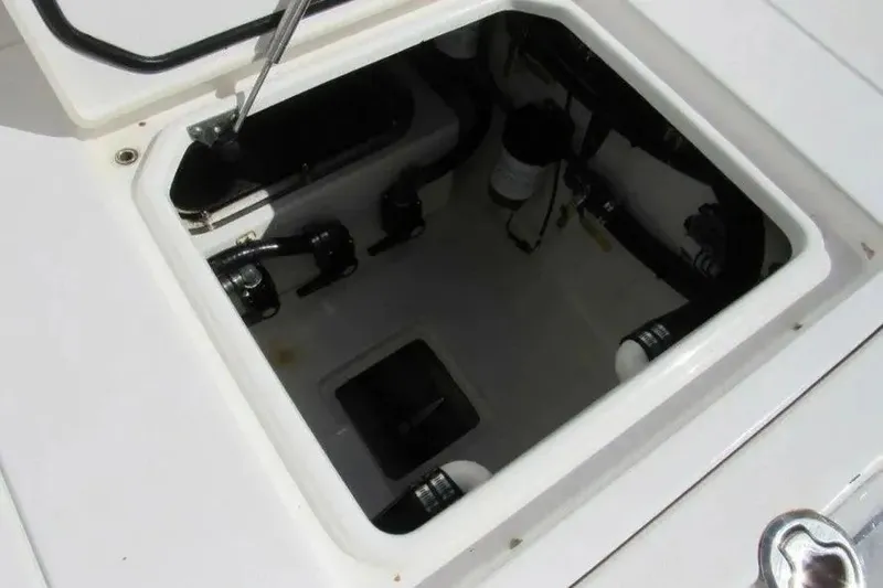 Slide: The Image of Open hatch of 2019 Contender 39 ST boat showing internal components. - 17