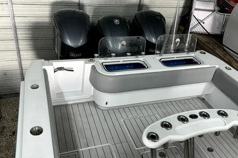 Slide: The Image of 2014 Contender 39 ST boat deck with triple 300 horsepower engines. - 20