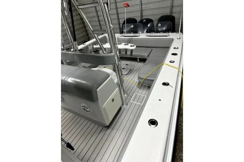 Slide: The Image of 2014 Contender 39 ST boat interior with seating and fishing rod holders. - 22