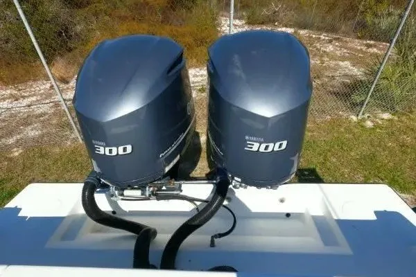 Slide: The Image of Twin Yamaha 300 outboard engines on a 1999 Contender 28 Sport boat. - 10
