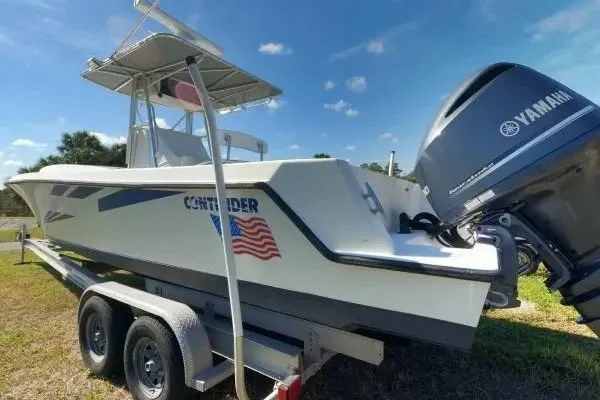 Slide: The Image of 1999 Contender 28 Sport boat on trailer with Yamaha outboard motor. - 6