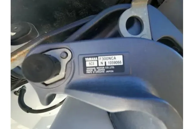 Slide: The Image of Close-up of Yamaha F300NCA engine part on 1999 Contender 28 Sport boat. - 18