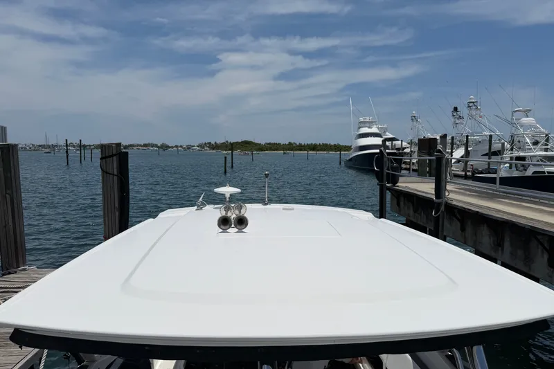 Slide: The Image of 2018 Monterey 378SE Super Express docked at marina with clear blue sky. - 14