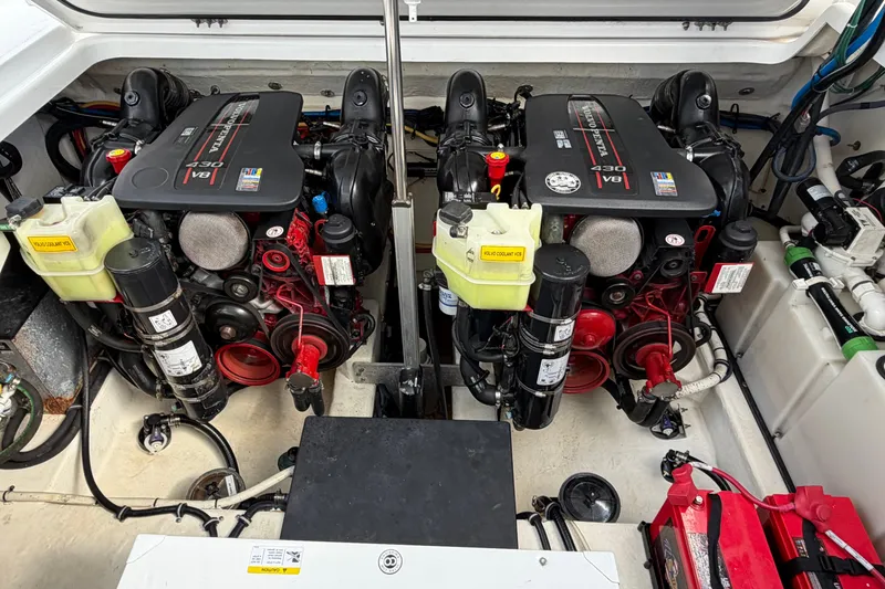 Slide: The Image of Engine compartment of a 2018 Monterey 378SE Super Express boat, featuring dual V8 engines. - 34
