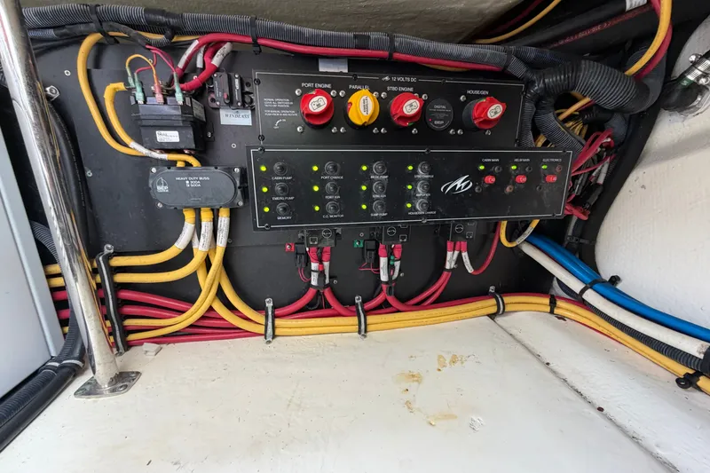 Slide: The Image of Electrical panel of a 2018 Monterey 378SE Super Express boat with wiring and switches. - 31