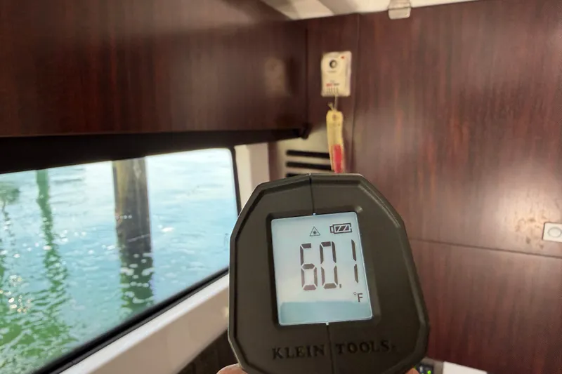 Slide: The Image of Digital thermometer reading 60.1°F inside 2018 Monterey 378SE Super Express boat cabin. - 23