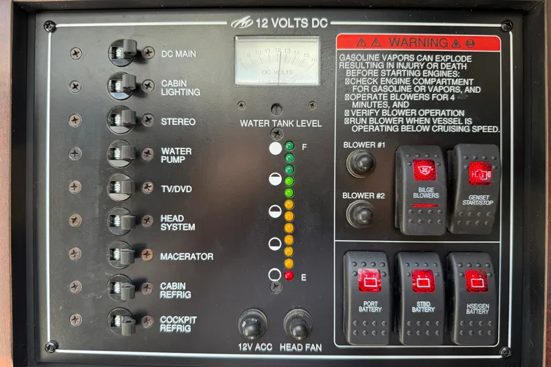 Slide: The Image of Control panel of a 2018 Monterey 378SE Super Express boat, featuring switches and warning labels. - 28