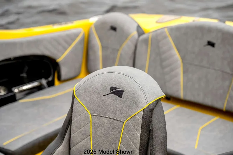 Slide: The Image of The image shows the seats of a boat with gray and yellow upholstery design. - 9