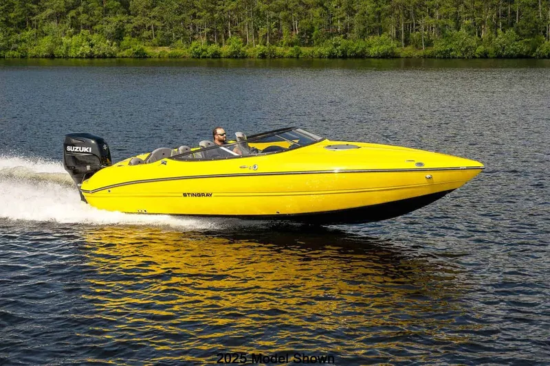 Slide: The Image of A bright yellow motorboat speeds across a calm lake, surrounded by trees. - 17