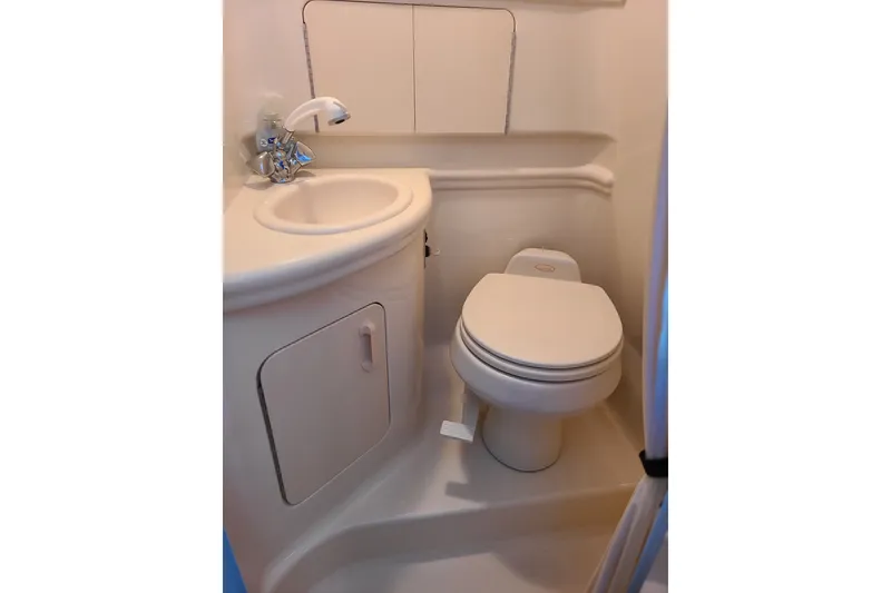 Slide: The Image of Compact bathroom in 2004 Sea Ray Sundancer 280 yacht with sink and toilet. - 8