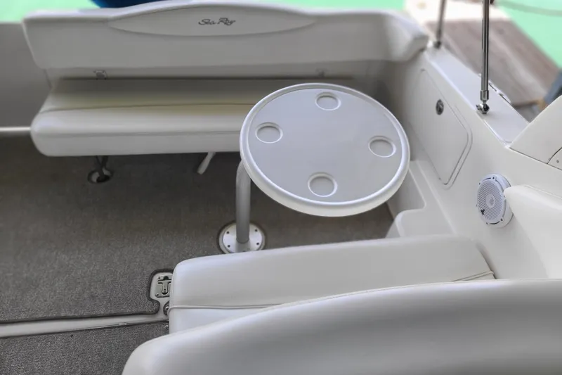 Slide: The Image of Interior of 2004 Sea Ray Sundancer 280 with seating and round table. - 12