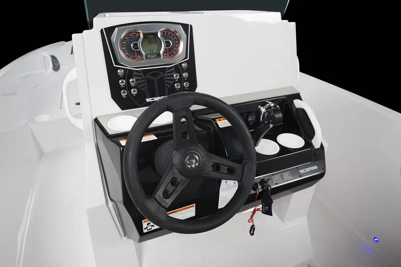 Slide: The Image of The image shows the helm of a 2019 Scarab 195 Open G boat with a modern dashboard. - 8
