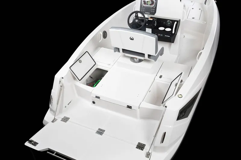 Slide: The Image of The image shows a 2019 Scarab 195 Open G boat with an open deck and helm console. - 6