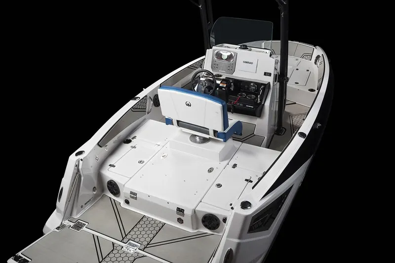 Slide: The Image of The image shows a 2019 Scarab 195 Open ID boat with a modern helm and seating area. - 15