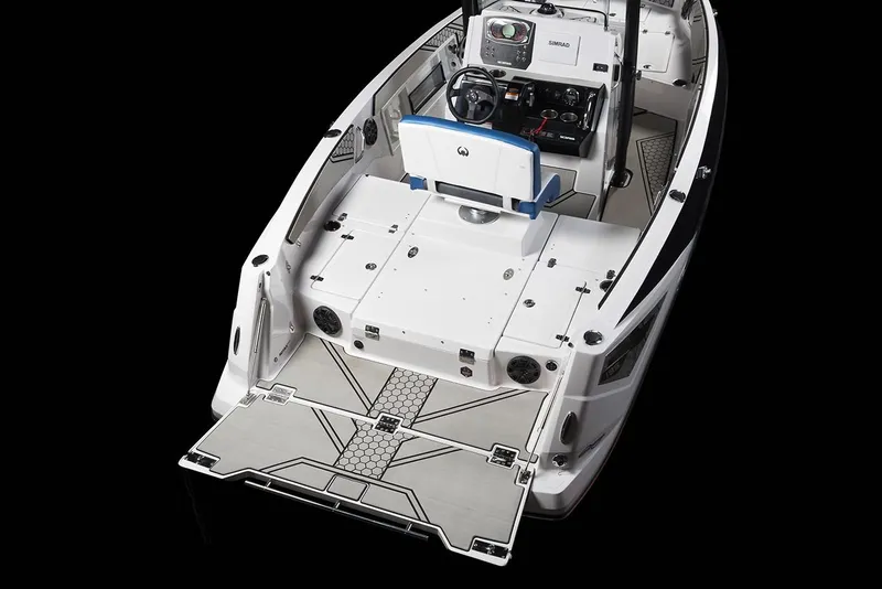Slide: The Image of The image shows a 2019 Scarab 195 Open ID boat with an open deck and modern helm console. - 14
