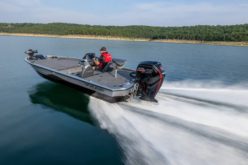 Slide: The Image of A 2024 Vexus AVX1880 boat speeds across a calm lake, piloted by a person. - 17