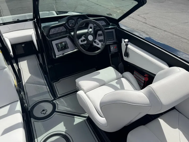 Slide: The Image of The image shows the cockpit of a 2020 MasterCraft NXT20 with a modern helm. - 12