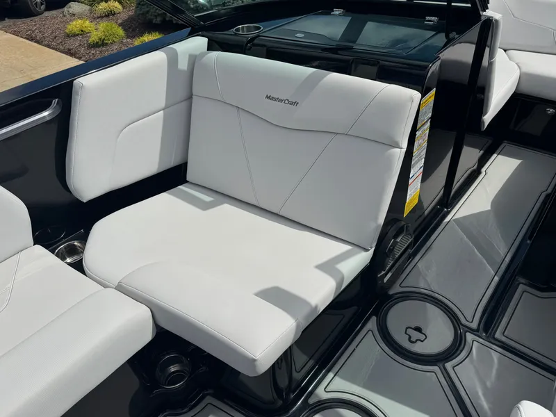 Slide: The Image of The 2020 MasterCraft NXT20 features white upholstery and a modern, stylish design. - 14