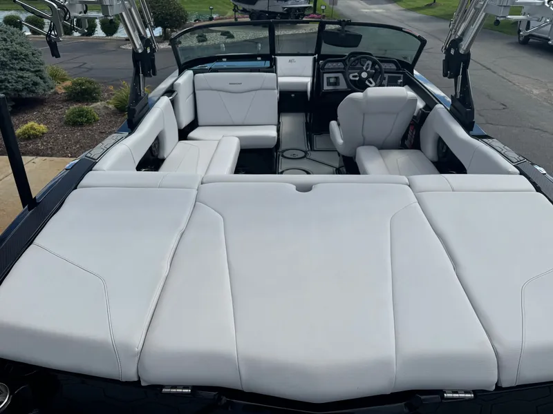 Slide: The Image of The image shows the interior of a 2020 MasterCraft NXT20 with white upholstery. - 8