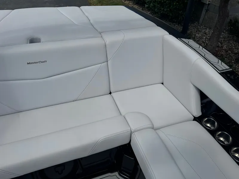 Slide: The Image of The 2020 MasterCraft NXT20 features luxurious white upholstery with sleek stitching. - 9