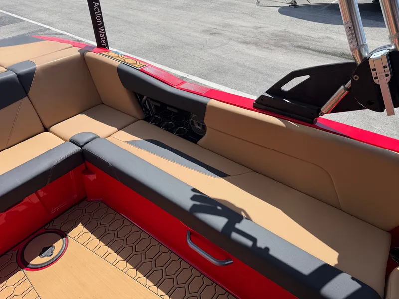 Slide: The Image of The image shows the interior of a 2022 MasterCraft NXT24 with beige and black seating. - 12