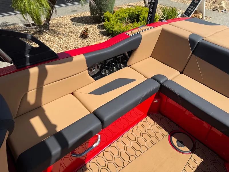 Slide: The Image of The image shows the cockpit of a 2022 MasterCraft NXT24 with beige and black seating. - 11