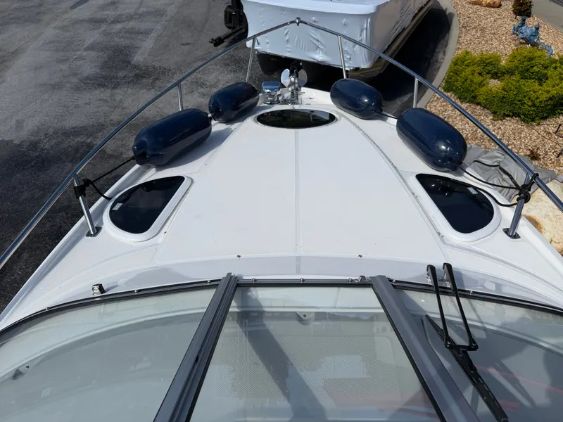 Slide: The Image of The image shows the foredeck of a Regal 28 Express boat with blue fenders. - 15