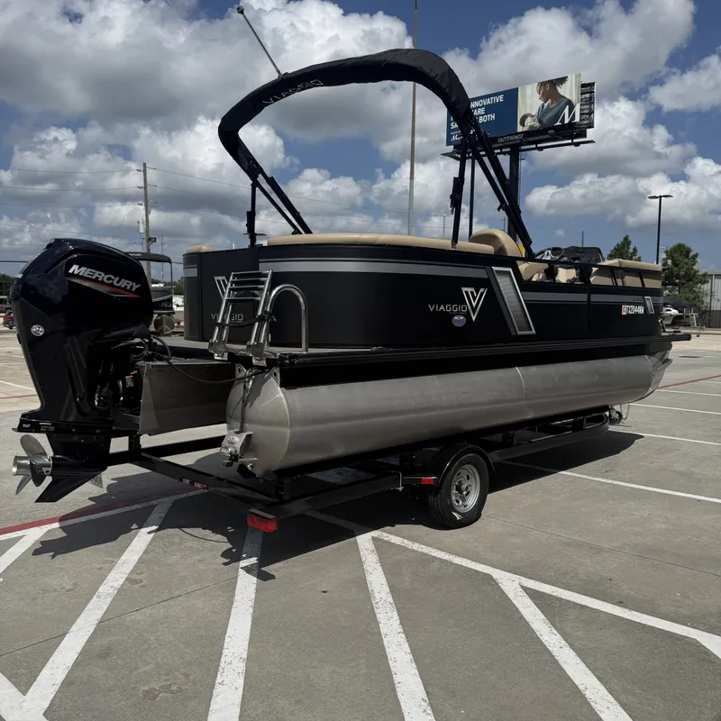 Slide: The Image of A 2022 Viaggio L20U pontoon boat on a trailer, featuring a Mercury outboard motor. - 8