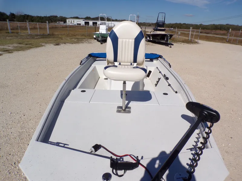 Slide: The Image of A 2018 G3 Bay 18 boat with a central seat on an open deck. - 15