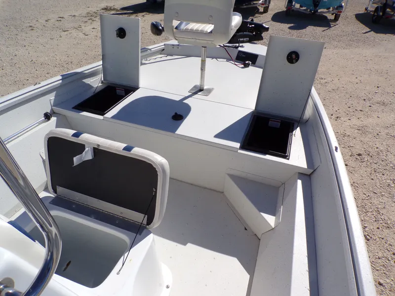 Slide: The Image of The image shows the deck of a 2018 G3 Bay 18 boat with storage compartments and seating. - 18