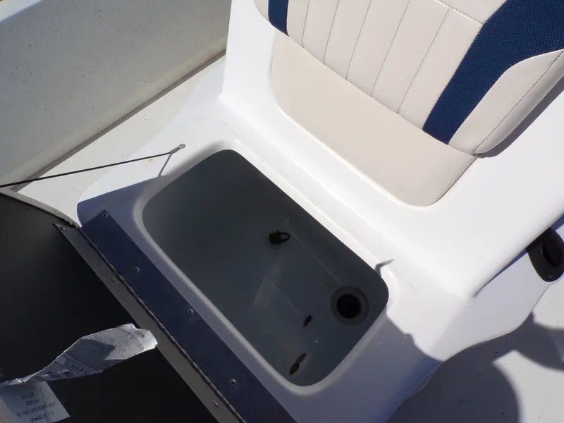 Slide: The Image of An open storage compartment on a boat with a cushioned seat above. - 6