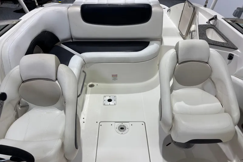 Slide: The Image of 2008 Chaparral 236 SSX boat interior with white seating and modern design. - 6