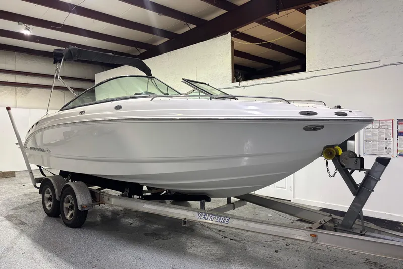 Slide: The Image of 2008 Chaparral 236 SSX boat on trailer in indoor storage facility. - 5