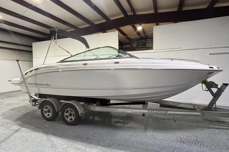 The Image of 2008 Chaparral 236 SSX boat on trailer in indoor storage facility. - 0
