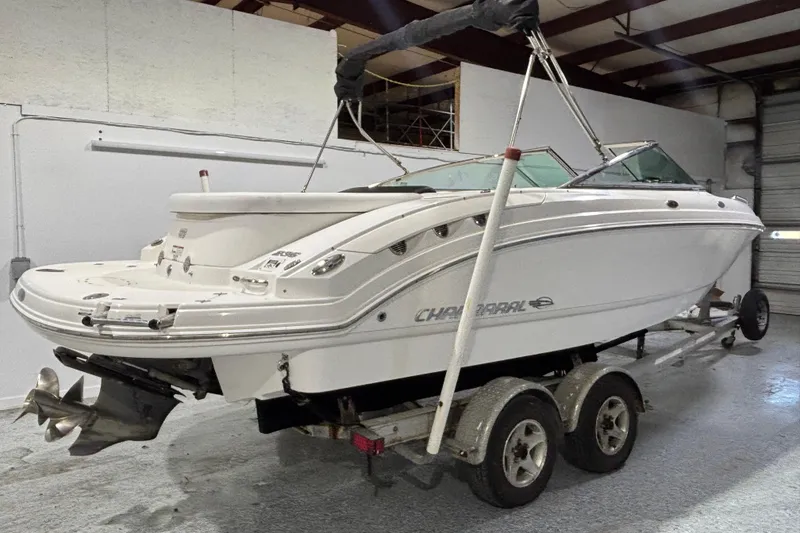 Slide: The Image of 2008 Chaparral 236 SSX boat on trailer in indoor storage facility. - 1