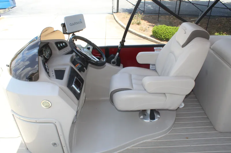 Slide: The Image of The image shows the helm of a 2016 Bennington 2250GSR with a comfortable captain's chair. - 10