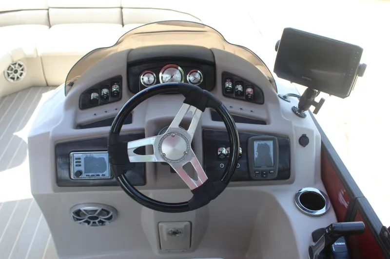 Slide: The Image of The image shows the helm of a 2016 Bennington 2250GSR with modern instruments and a display screen. - 9
